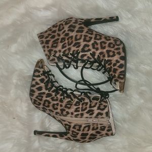 Used size 6.5 leopard lace-up, ankle boot with the gold toe trim